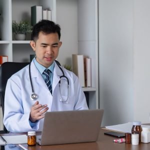 Male Doctor Engaged in Medical Studies for Advancing Health Care Practices in a Modern Clinical